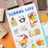 ✏️📖 School is in session, and @mochigardens’ adorable little students are doing their very best… mostly! From acing tests and hauling backpacks to sneaking snacks, falling asleep on textbooks, and tackling some seriously confusing homework, these studious critters know that school life is a mix of hard work and tiny treats. Art by: @mochigardens

Top Coating: None
Adhesive Layer: PVC (plastic)
Backing Layer: Clear PET
6.69" x 3.54".
Weight - 0.03lbs
1 sheet included