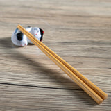 These cute ceramic rests are a perfect stationery addition to your desk! Use them for pens, paint brushes, or take them to your kitchen as a chopstick rest!

Size: 2"
Material: Ceramic
Weight:1.6 oz (45.36 g)
Origin: China