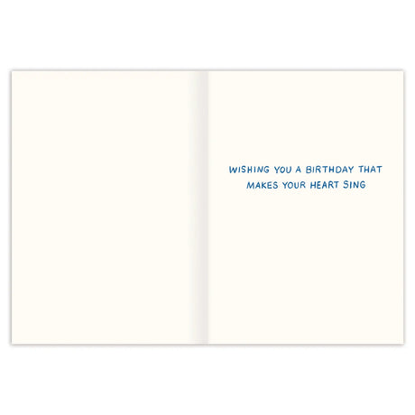 Inside verse: Wishing you a birthday that makes your heart sing

• Illustrated by Emily Taylor
• Pre-priced
• Size: A6, 4.5" x 6.25"
• Paired with a Kraft envelope
• Printed in the USA.

About The Artist: Emily&nbsp;Taylor&nbsp;draws and daydreams from her studio in a tiny town north of Toronto, Canada. Her work is best known for its feel of modern nostalgia, its painterly linework and joyful colors.&nbsp;Emily&nbsp;is inspired most by walks in nature and slow wanderings of antique markets.