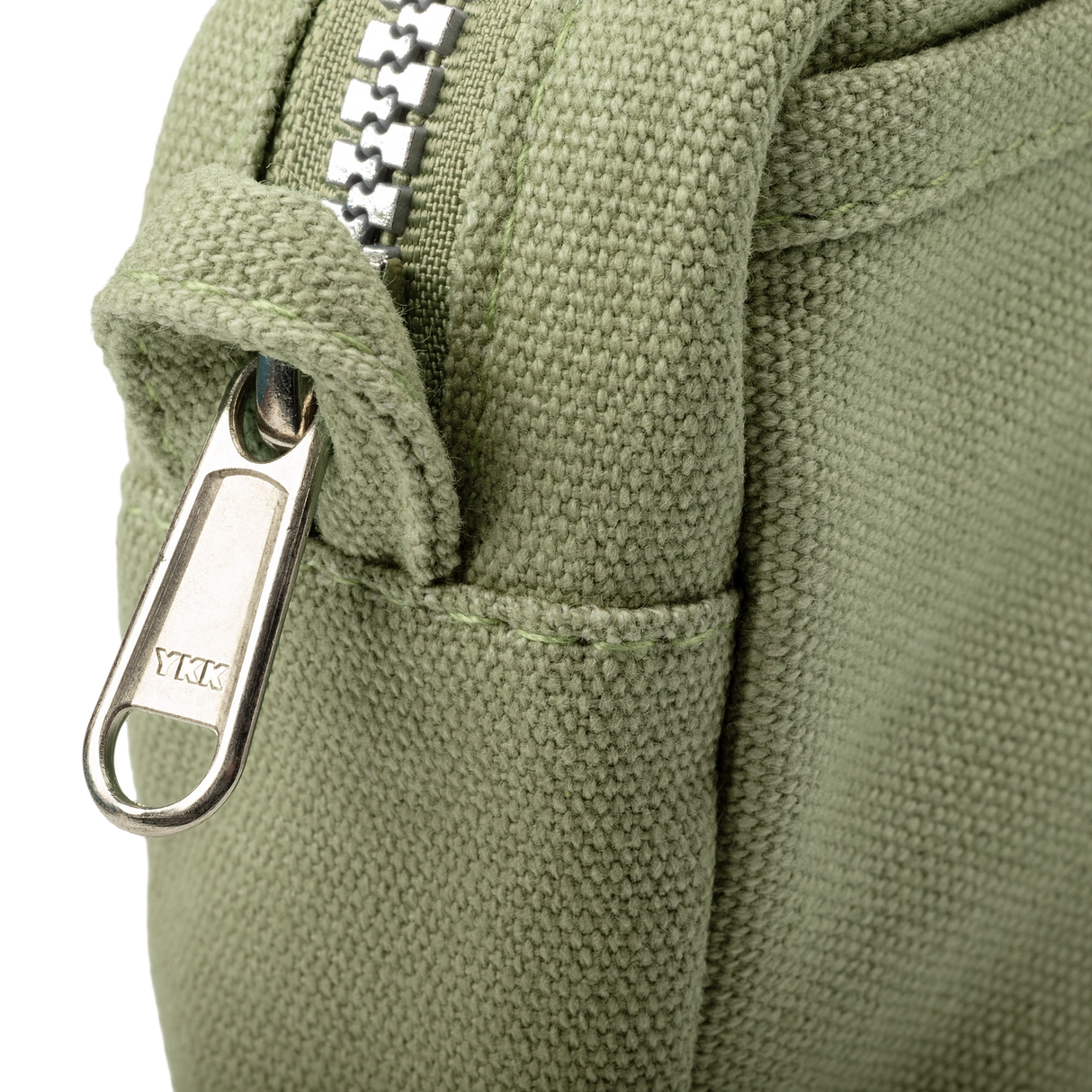 Features &amp; Specs

Front layout: 8 slanted pockets + 3 directly behind
Interior: Main compartment fits an A5 notebook; two open compartments on each wall
Back panel: 3 wide exterior pockets + one full-length slip pocket&nbsp;
Quick-drying duck canvas — sturdy, breathable, and machine-washable
Convertible design — hooks for your own strap or a Soolla strap (coming soon)&nbsp;
Structured silhouette — holds its shape even when lightly packed
Full-width YKK zipper — smooth and durable
Compact profile — fits 
