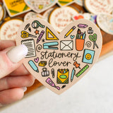 Show your love for all things paper, pens, and planning with this Stationery Lover sticker! Shaped like a heart and filled with doodles of your favorite supplies, it’s perfect for adding a crafty touch to your laptop, notebook, or journal.