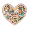 Show your love for all things paper, pens, and planning with this Stationery Lover sticker! Shaped like a heart and filled with doodles of your favorite supplies, it’s perfect for adding a crafty touch to your laptop, notebook, or journal.