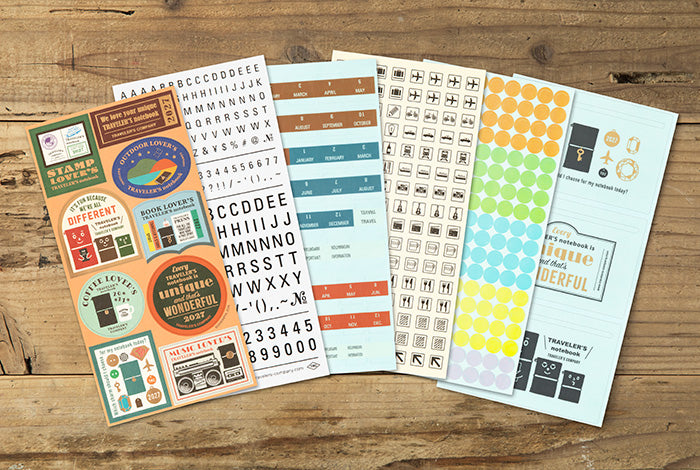This is a sticker set for customizing your TRAVELER’S notebook that makes it more fun, including index and pocket stickers, icon stickers to represent different plans, dry transfer, and stickers to decorate the cover. The 2027 version features a design that is inspired by “Every TRAVELER’S notebook is unique and that’s wonderful.” You can customize your 2027 diary, and that’s wonderful.