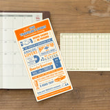 Plastic Sheet (or underlay sheet) is designed to let you write standing up by providing a sturdy surface underneath your page. You can also use it as a bookmark to instantly open to a certain page. The stiff material of the sheet can help you draw straight lines as if it were a ruler.


The theme of the 2026 edition is THE TRAVELER'S SPIRIT, designed to reflect the spirit of the traveler.