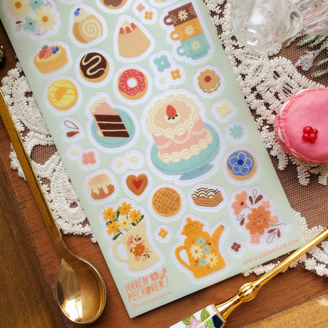🫖🍩 A delish pastry really is the cherry on top of a lovely tea time and @havenpeckover offers us a divine variety that’s sure to take any tea time to the next level. These freshly baked goods are not just a feast for the stomach, but also a feast for the eyes! Art by: @havenpeckover

Top Coating: Textured
Adhesive Layer: PVC (plastic)
Backing Layer: Clear PET
6.69" x 3.54".
Weight - 0.03lbs
1 sheet included