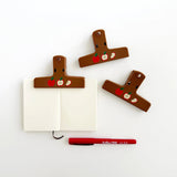 The Paper + Craft Pantry Journal Clip - Apples

Meet your new favorite clip! Featuring hand-drawn apples, this cute clip will be your lil desk assistant. It's perfect for keeping your planner or journal open!