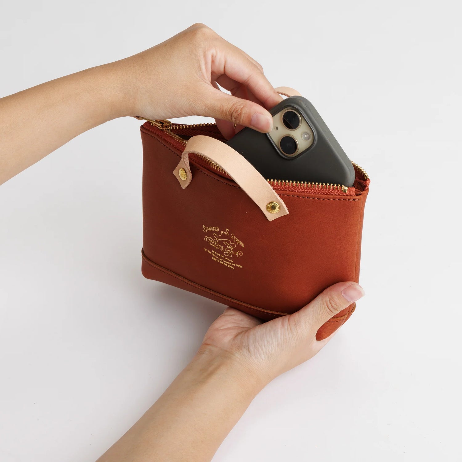 We made a miniature version of our engineer bag as a key case,and somehow, this one turned out a little bigger.

Still, the plump, playful leather pouch is fun to carry and somehow even looks delicious.

It’s sized to fit a paperback or an A6 notebook.

Size: W19.5×H12.5×D4.5cm
About the Leather – Japanese Glove Leather

Made from durable and supple Japanese glove leather, known for its lightness and strength.

Originally used for baseball gloves, this leather is highly resistant to friction and becomes sof