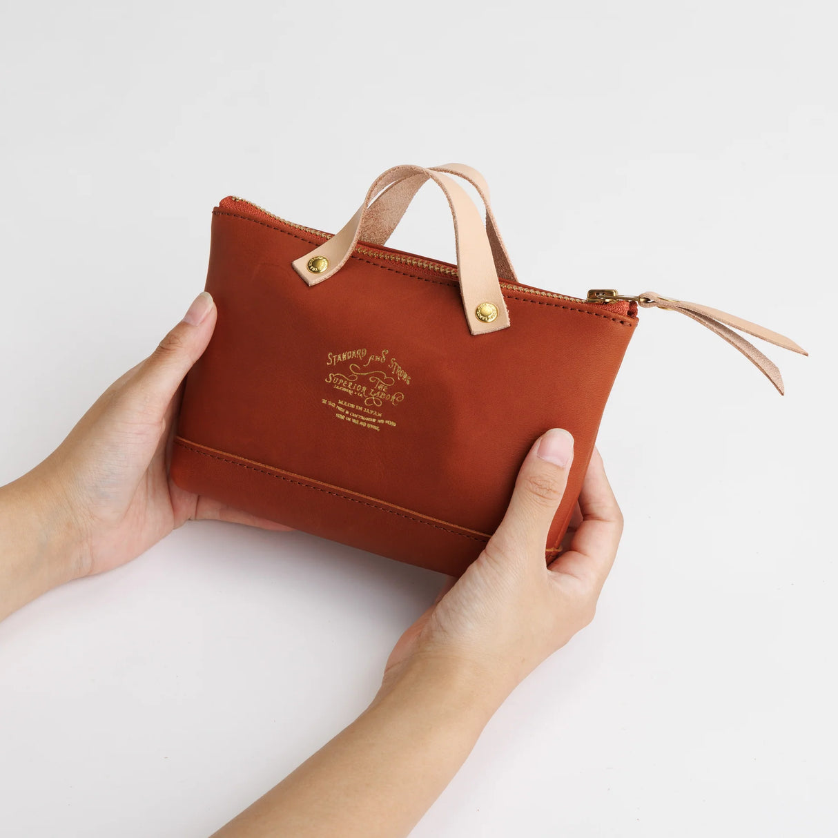 We made a miniature version of our engineer bag as a key case,and somehow, this one turned out a little bigger.

Still, the plump, playful leather pouch is fun to carry and somehow even looks delicious.

It’s sized to fit a paperback or an A6 notebook.

Size: W19.5×H12.5×D4.5cm
About the Leather – Japanese Glove Leather

Made from durable and supple Japanese glove leather, known for its lightness and strength.

Originally used for baseball gloves, this leather is highly resistant to friction and becomes sof