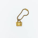 Brass charm in the shape of an engineer tote bag.

Equipped with a sleek ball chain, it attaches effortlessly to your bags, pouches, or key rings. Despite its petite size, it brings the distinct, rich texture and unmistakable presence that only genuine brass can provide.

As you use it, the brass will develop a natural patina over time—enjoy the changing character that comes with age.

Color: The color you see on your screen may differ from the actual product.

Brass Products

Due to the nature of brass, so