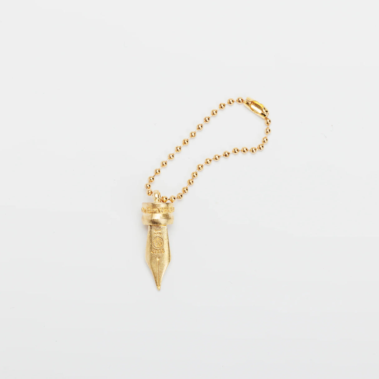 A Fountain Pen Nib Charm: Carried with Meaning

A solid brass charm meticulously shaped in the likeness of a classic fountain pen nib. Every intricate detail is beautifully captured, complete with the inspiring engraved message, "The Pens Will Be With You Always."

Equipped with a sleek ball chain, it attaches effortlessly to your bags, pouches, or key rings. Despite its petite size, it brings the distinct, rich texture and unmistakable presence that only genuine brass can provide.

As you use it, the brass
