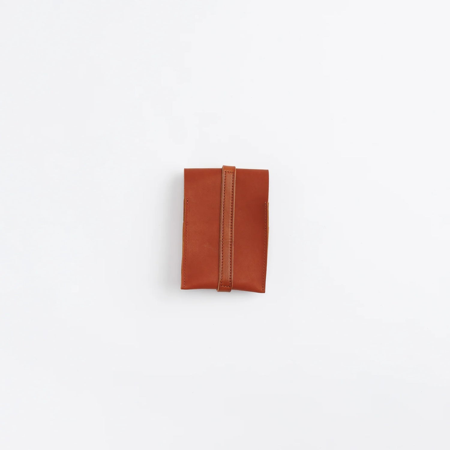 The SUPERIOR LABOR Glove Leather - Tool Holder

The discontinued tool holder&nbsp;is back with a redesigned construction.

The raw-cut edges are accented with a brass tag, and the interior logo is finished with gold foil.&nbsp;The result is a refined, elegant look that still feels light and airy.&nbsp;It’s perfect for carrying pens and other everyday tools.

Size: W10.5×H15.5×D2cm
About the Leather – Japanese Glove Leather

Made from durable and supple Japanese glove leather, known for its lightness and str