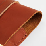 The SUPERIOR LABOR Glove Leather - Tool Holder

The discontinued tool holder&nbsp;is back with a redesigned construction.

The raw-cut edges are accented with a brass tag, and the interior logo is finished with gold foil.&nbsp;The result is a refined, elegant look that still feels light and airy.&nbsp;It’s perfect for carrying pens and other everyday tools.

Size: W10.5×H15.5×D2cm
About the Leather – Japanese Glove Leather

Made from durable and supple Japanese glove leather, known for its lightness and str
