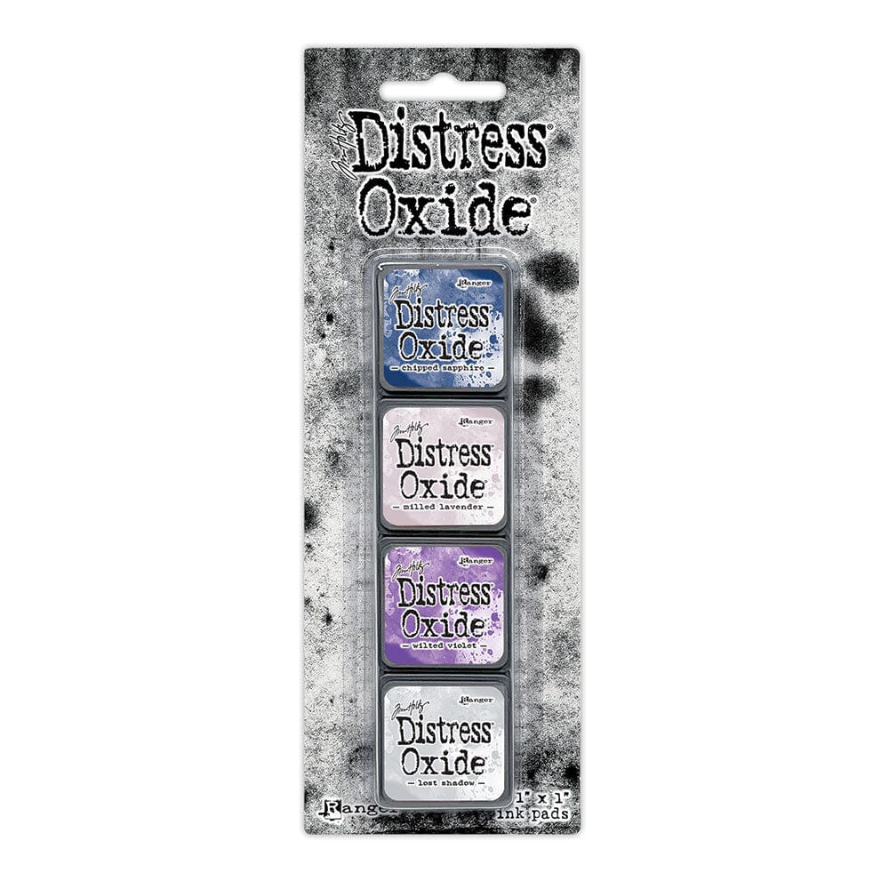 Tim Holtz Distress Mini Oxide Ink Pads are a collection of 1 x 1 cubes featuring water-reactive dye &  pigment ink fusion that creates an oxidized effect when sprayed with water.