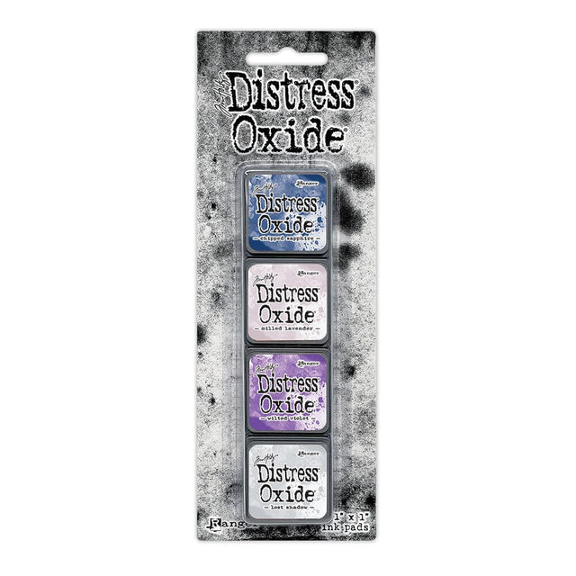 Tim Holtz Distress Mini Oxide Ink Pads are a collection of 1 x 1 cubes featuring water-reactive dye &  pigment ink fusion that creates an oxidized effect when sprayed with water.