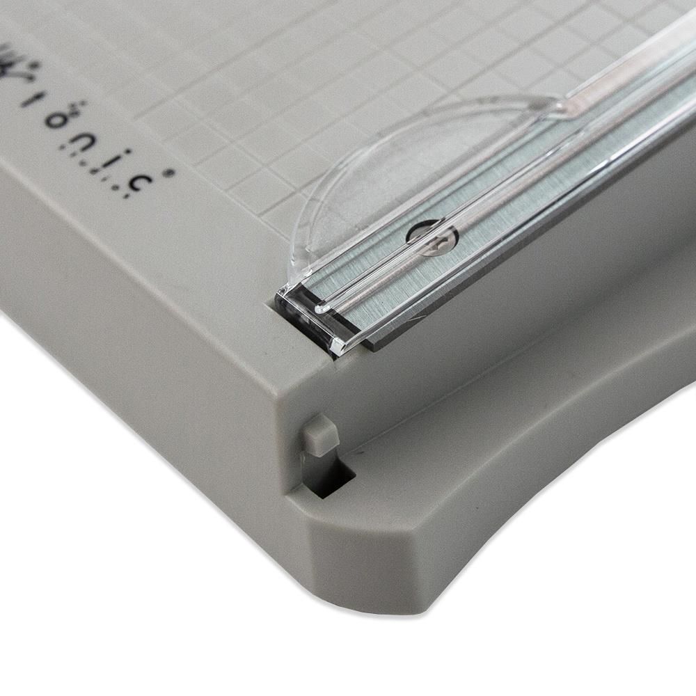 The Tim Holtz 6.25 inch / 16cm Mini Trimmer has many features not found in similar products. This product is portable and lightweight. It is perfect for trimming photographs and creating card fronts.

Features include: Hardened steel precision ground blade, Molded in measuring grid, 6.25 inch / 16cm cutting blade length and Finger guard that holds your paper in position for the perfect cut.

Width &nbsp; &nbsp;5.4 in &nbsp; &nbsp;/ &nbsp; &nbsp;13.72 cm
Height &nbsp; &nbsp;1.7 in &nbsp; &nbsp;/ &nbsp; &nbsp