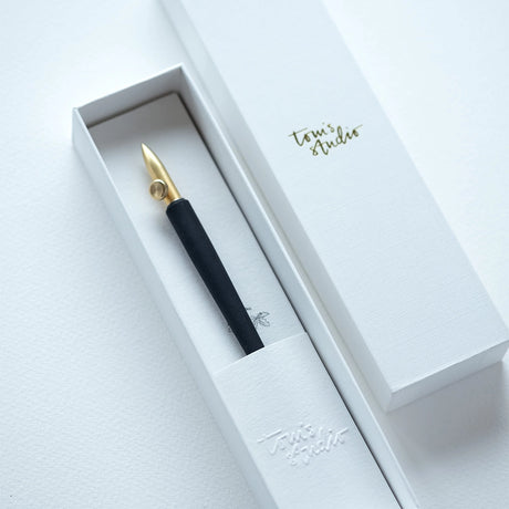 An experimental calligraphy nib. This nib is a delight for illustrators and calligraphers, offering the ability to adjust the nib for a wide range of stunning line variations. With a simple twist of the thumb screw, you can produce broader or finer lines, or change the nib's angle to the page to create rich, thick strokes.