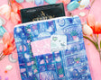 Unicorn Eclipse - Reading Room Book Sleeve

✧Size &amp; Materials✧

Approximate size (WxH): 9 x 12 in
Padded, includes zipper and back pocket&nbsp;
Polyester canvas
Fits our 7x9" notebook, books, 11 in Ipad Pro model, tablets (do your own measurements)