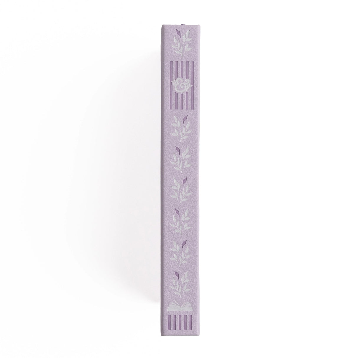 A dreamy notebook in gentle lilac vegan leather, inspired by classic library bindings. Subtle geometric embossing frames a delicate open-book motif, creating a clean, elegant design that appeals to book lovers, writers, and everyday creatives.