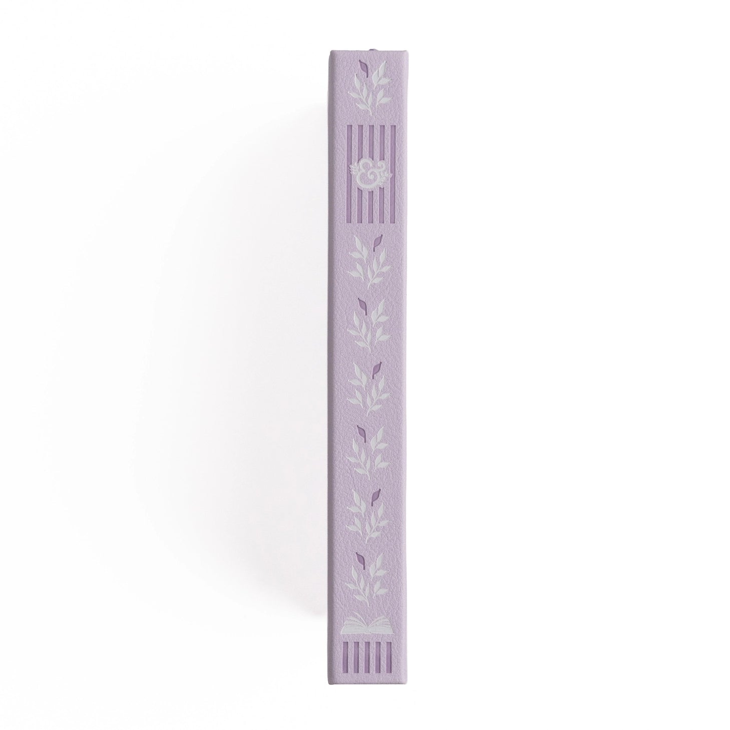 A dreamy notebook in gentle lilac vegan leather, inspired by classic library bindings. Subtle geometric embossing frames a delicate open-book motif, creating a clean, elegant design that appeals to book lovers, writers, and everyday creatives.
