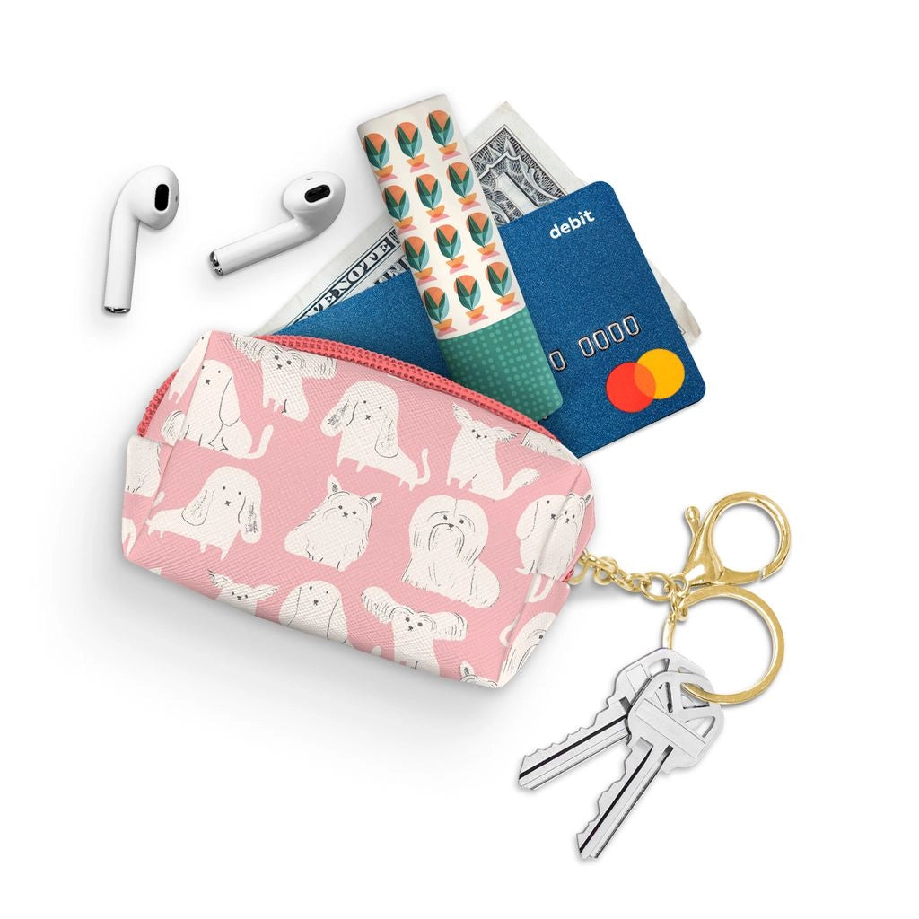 This convenient, lightweight pouch from Studio Oh! provides a secure and stylish way to carry essentials with your keys. Featuring a water-resistant, canvas-textured material and lined interiors, the pouch is both durable and easy to clean. The petite loaf shape is roomy enough for an array of personal items, such as IDs, cards, lip balm, gum, cash, coins, earbuds, nail clippers, and more. The zipper closure includes both a key ring and a lobster-claw clasp, making it simple to attach to a purse.