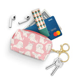 This convenient, lightweight pouch from Studio Oh! provides a secure and stylish way to carry essentials with your keys. Featuring a water-resistant, canvas-textured material and lined interiors, the pouch is both durable and easy to clean. The petite loaf shape is roomy enough for an array of personal items, such as IDs, cards, lip balm, gum, cash, coins, earbuds, nail clippers, and more. The zipper closure includes both a key ring and a lobster-claw clasp, making it simple to attach to a purse.