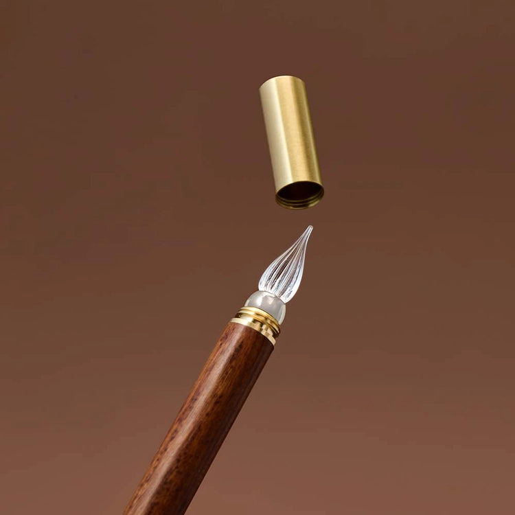 A modular glass pen that combines a glass nib with an elegant rosewood body.&nbsp;

The modular design allows the pen to be used for many years to come due to its easy nib replacement system. Designed to be easy to use and clean, the nib can be detached easily and lightly rinsed with water for cleaning.

The screw on brass cap allows for safe transport and storage making it perfect for use on the go.&nbsp;