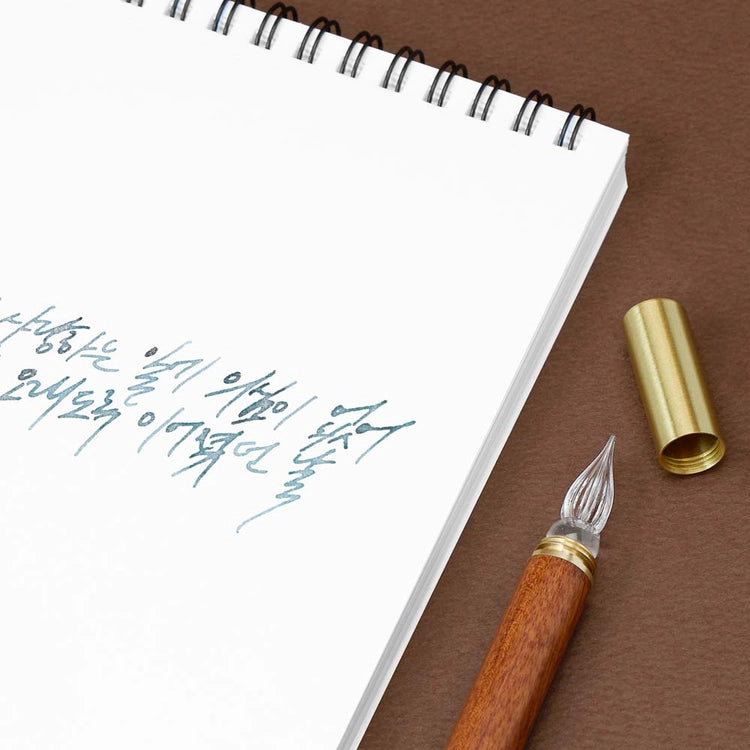 A modular glass pen that combines a glass nib with an elegant rosewood body.&nbsp;

The modular design allows the pen to be used for many years to come due to its easy nib replacement system. Designed to be easy to use and clean, the nib can be detached easily and lightly rinsed with water for cleaning.

The screw on brass cap allows for safe transport and storage making it perfect for use on the go.&nbsp;