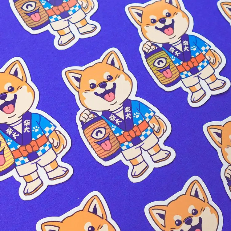 This is Mimi the Shiba - one of our original characters - he is dressed up to participate in a matsuri (Japanese festival) and he is holding a Chôchin-obake, a famous yokai-lantern in Japanese folklore.

• Vinyl sticker with holographic effect
• 4.6 x 7.3 cm
• Without PVC
• Anti-UV varnish
• Can be used outside
• Printed in Sweden