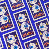 This illustration is inspired by Menko cards, an ancient Japanese game similar to the Pog game. The cards, made of more or less thick cardboard, were usually illustrated with characters from manga/TV series/movies, or athletes (mainly baseball players and sumos).

On this menko we can see Yû and Rei (), the little ghosts, two of our original characters.
The white triangle on their foreheads is called hitaikakushi and is a traditional attribute of yûrei (Japanese ghosts).

• Vinyl sticker
• 4.5 x 8.8 cm
• PV