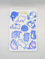 Featuring 12 adorably pudgy cats, each one sporting its own quirky personality, this 4"x6" vinyl sticker sheet is perfect for adding a touch of whimsy to your everyday items. From the cat who’s too cool for school to the one who’s just a little bit offbeat, these weirdos celebrate the joy of being different.