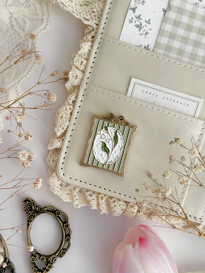 lily of the valley journal charm magnet - cute & cozy -  magnet is versatile! can be used for your notebook covers, fridge, ikea carts, or anything that attracts magnets! made with high quality, polished gold plated, soft enamel.

♡ polished gold plated

♡ size h: 30mm 